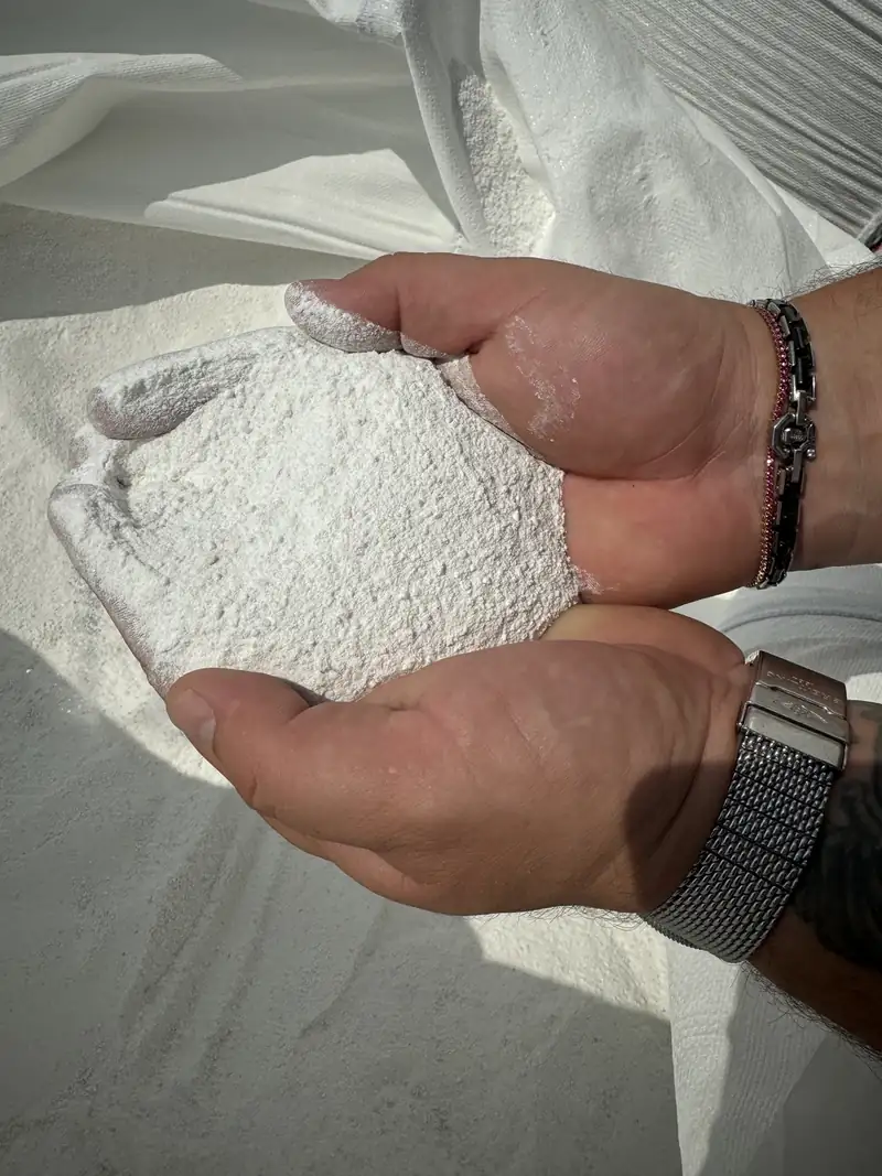 A handful of marble powder from Greece — raw material for the premium white panels