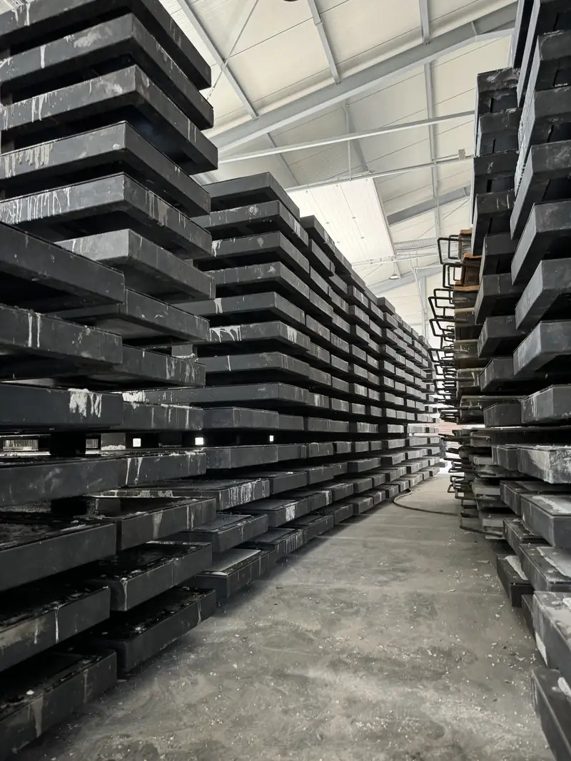 Aisle between the stacks of panel moulds in the hall